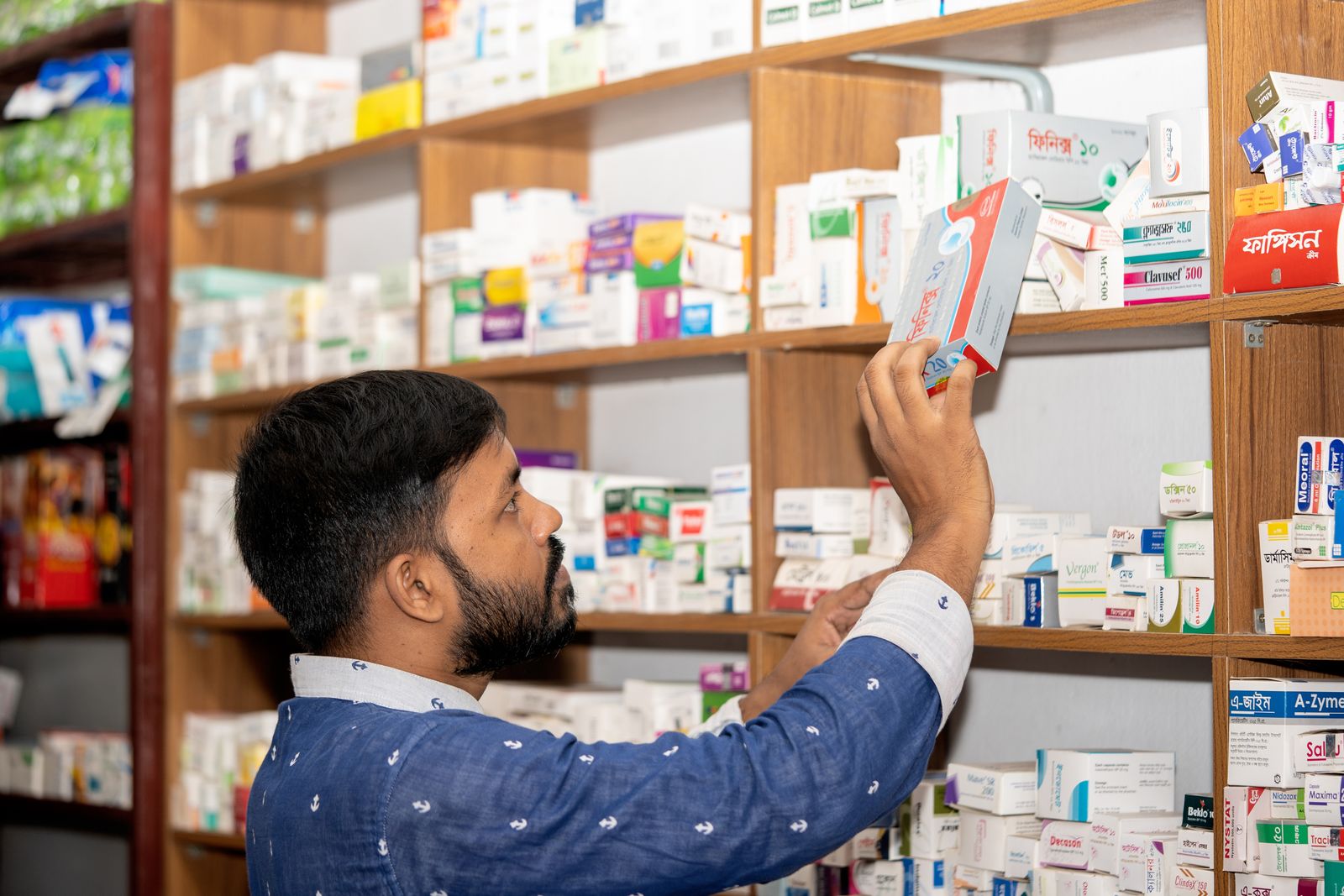 A local pharmacist at their neighbourhood chemist shop